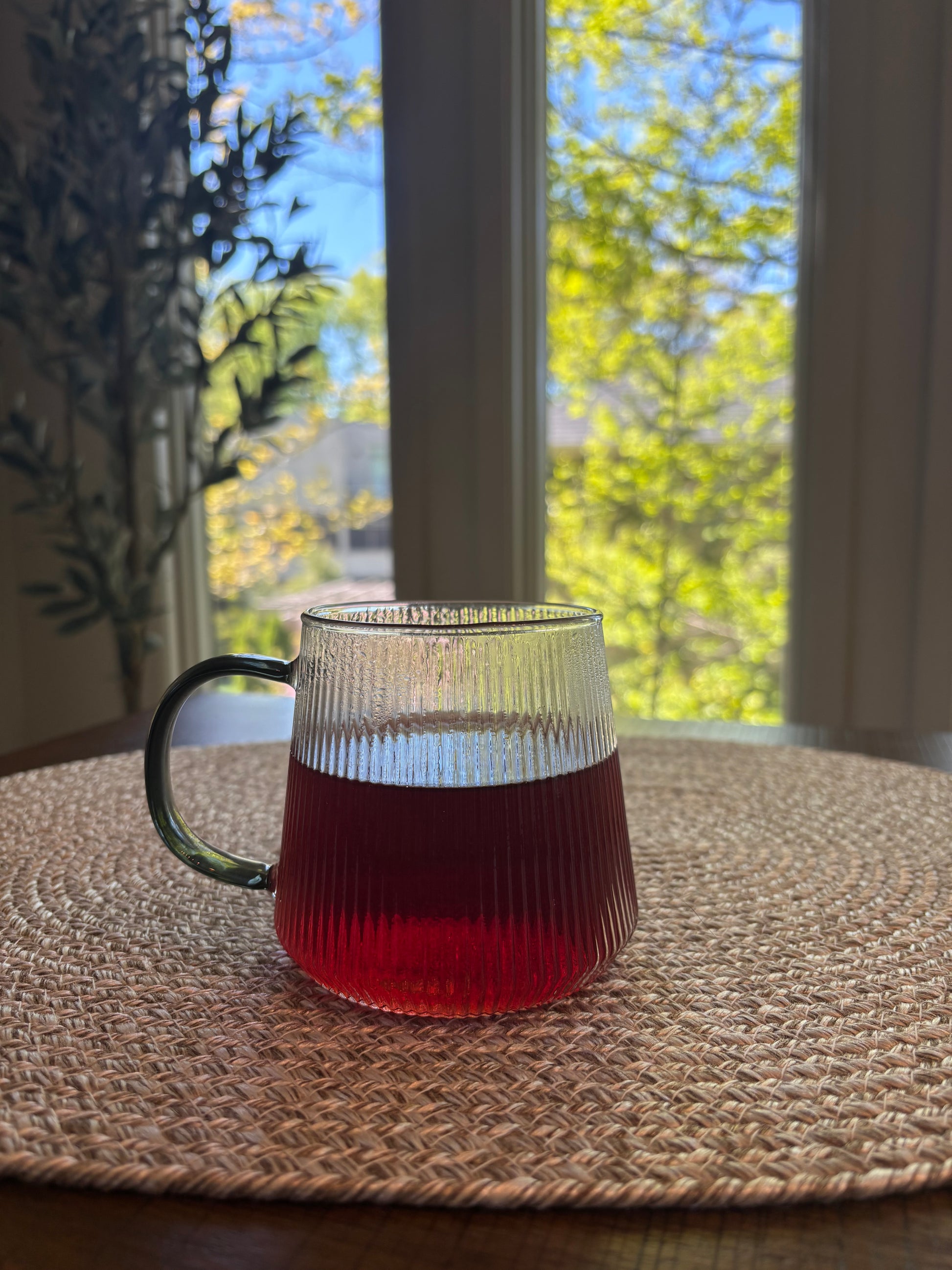glass cup with deep crimson liquid