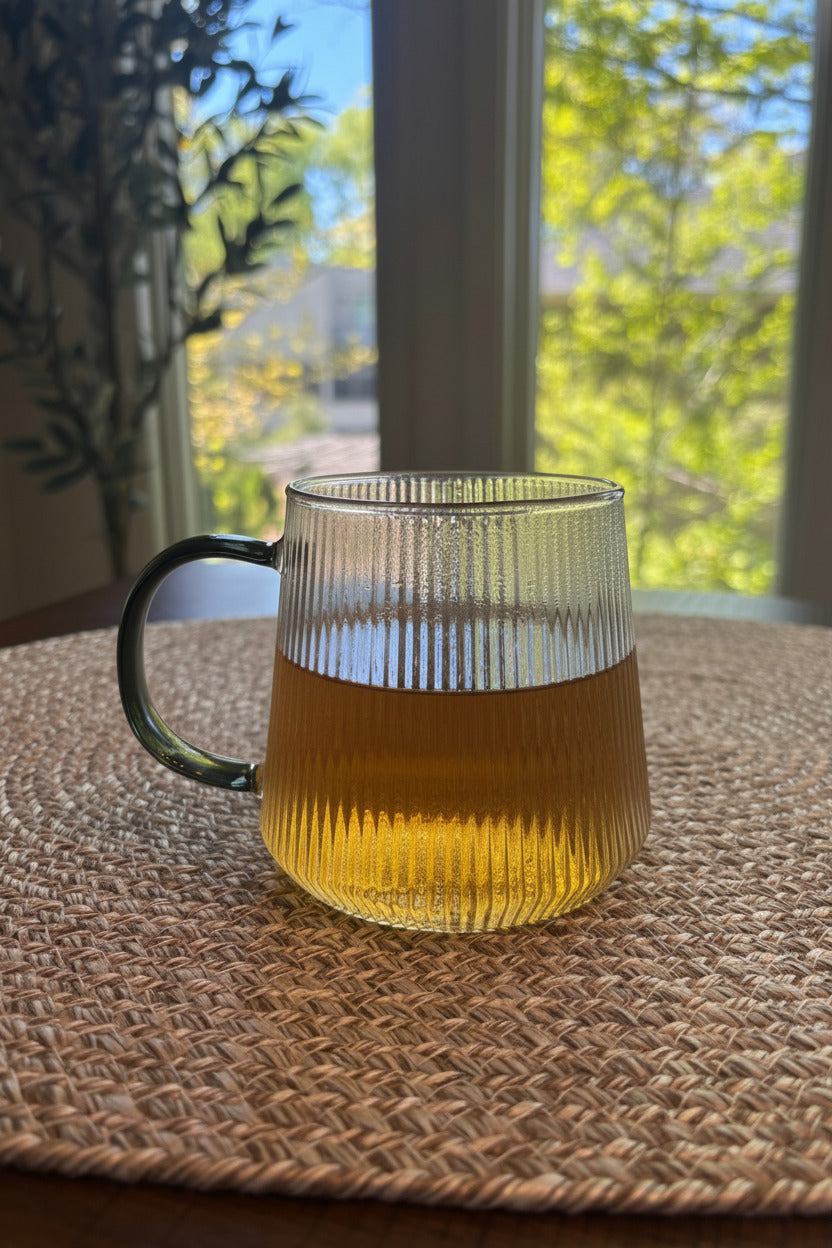 glass mug with a soft green liquid